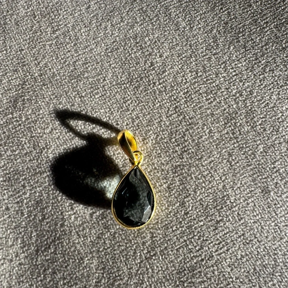 Elegant Gold and Black Teardrop Pendant